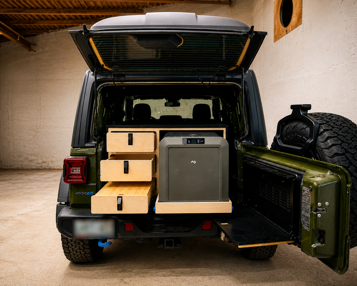 Custom rear 3-drawer and slide-out Dometic fridge system installed in a 2024 Jeep Wrangler 4xe,  by Overland Interiors.