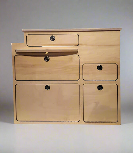 View of kitchen cabinet with five drawers and pull out surface, great for micro van conversions