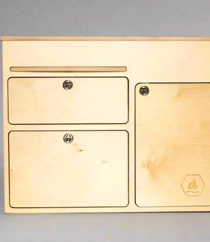 Front view of a 36-inch kitchen cabinet with drawers and storage door for camper van and overland vehicle conversions by Overland Interiors