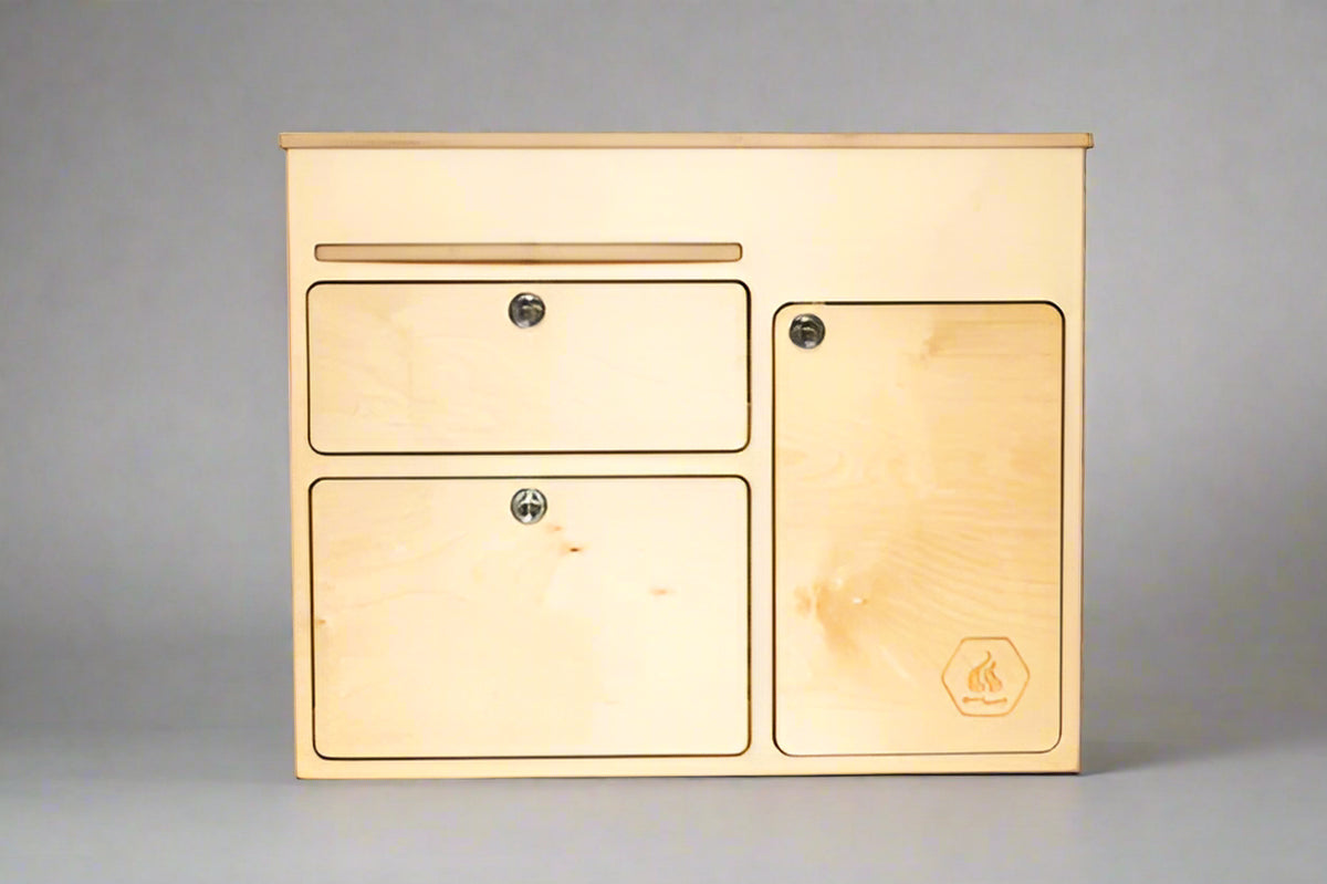 Front view of a 36-inch kitchen cabinet with drawers and storage door for camper van and overland vehicle conversions by Overland Interiors