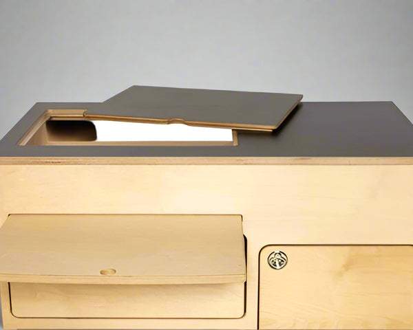 Top view of birch plywood 36" kitchen cabinet with black laminate top by Overland Interiors
