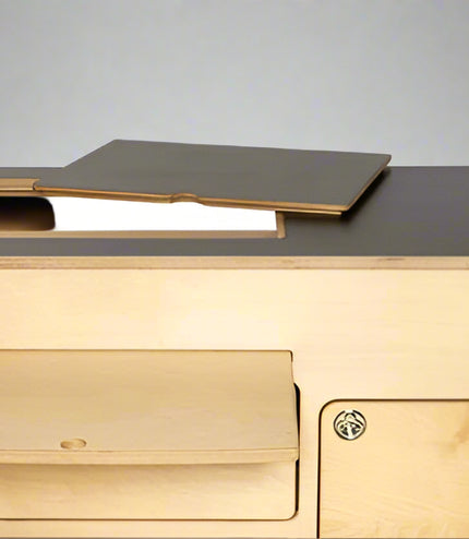 Top view of birch plywood 36" kitchen cabinet with black laminate top by Overland Interiors