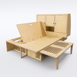 Overland Interiors Bed System for low roof vans designed for tall people with full-length sleeping platform and modular storage cabinets