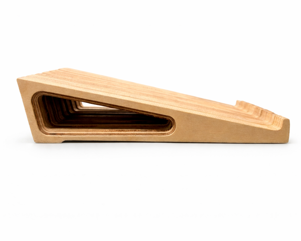 Profile view of a Baltic birch ergonomic wooden laptop stand by Overland Interiors