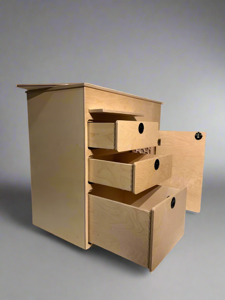 Camper van kitchen cabinet with open drawers and storage compartment by Overland Interiors