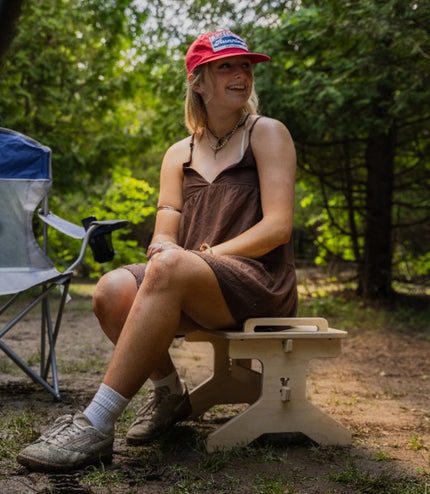Flat pack camper van step stool used as an extra outdoor camping seat by Overland Interiors