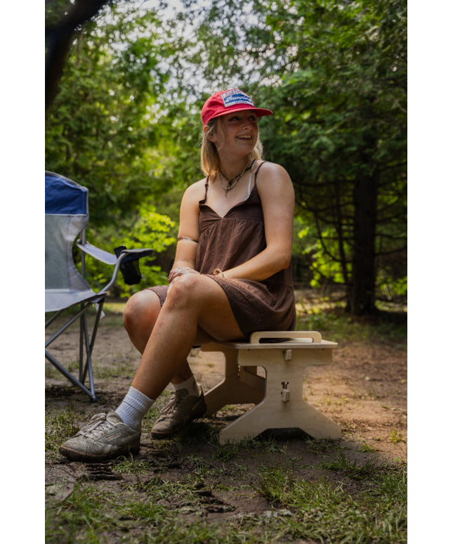 Flat pack camper van step stool used as an extra outdoor camping seat by Overland Interiors