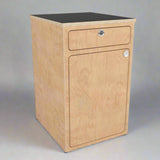 Angled view of a camper van storage cabinet with integrated drawer and utility storage by Overland Interiors.