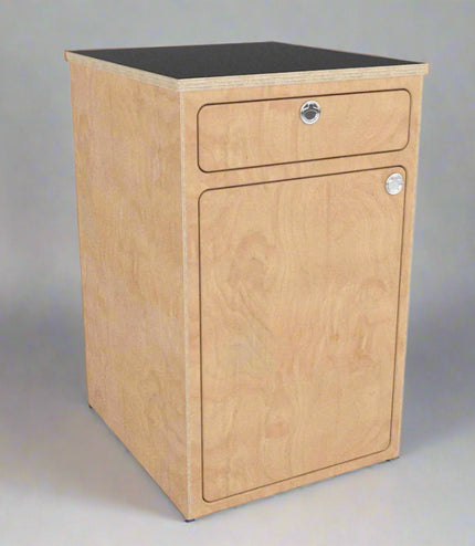 Angled view of a camper van storage cabinet with integrated drawer and utility storage by Overland Interiors.