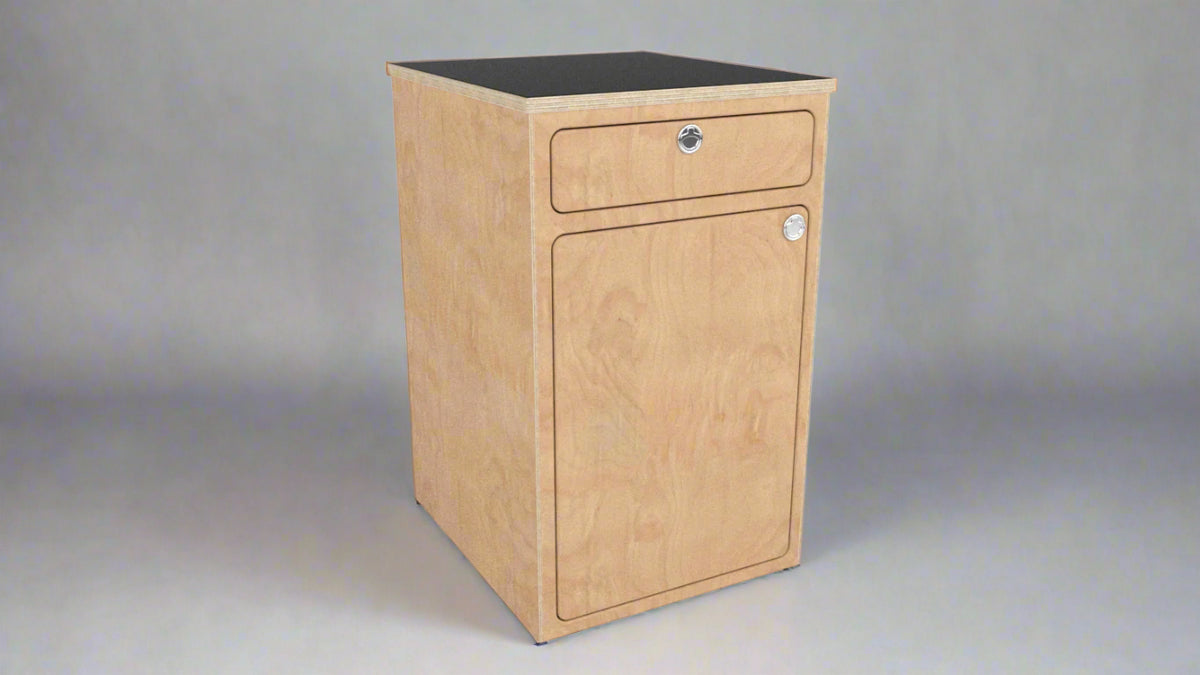 Angled view of a camper van storage cabinet with integrated drawer and utility storage by Overland Interiors.