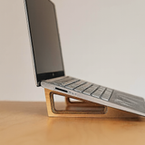 Side view of an ergonomic wooden laptop stand made from Baltic birch by Overland Interiors