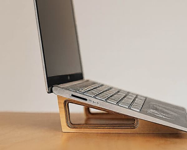 Side view of an ergonomic wooden laptop stand made from Baltic birch by Overland Interiors