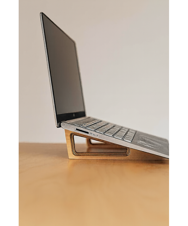 Side view of an ergonomic wooden laptop stand made from Baltic birch by Overland Interiors
