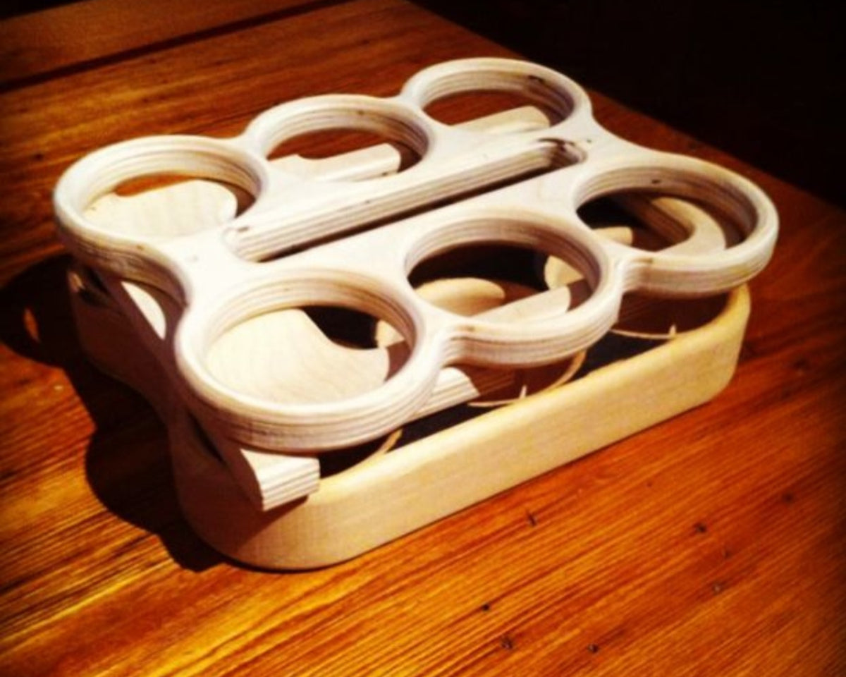 Flat pack wooden 6-pack beverage holder components made from birch plywood by Overland Interiors.