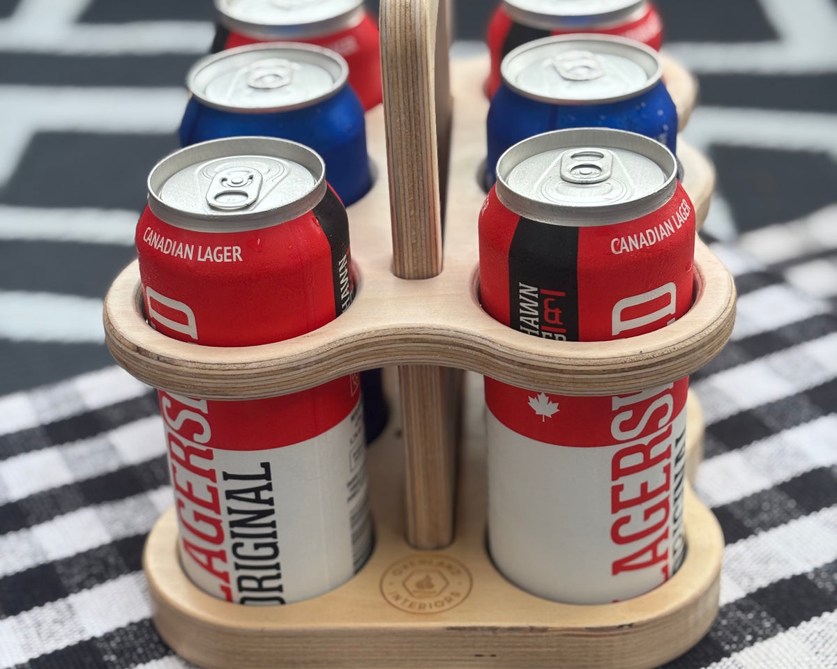 Flat pack birch wooden beer carrier holding six beverage cans by Overland Interiors.