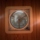 Overland Interiors MaxAir roof vent trim ring installed in wood camper van ceiling