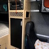 Custom fridge cabinet with integrated Breville oven, electrical panel and ventilation in a Mercedes Sprinter 144 camper van