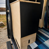 Custom birch plywood kitchen cabinet with counter top inside a Mercedes Sprinter 144 camper van by Overland Interiors