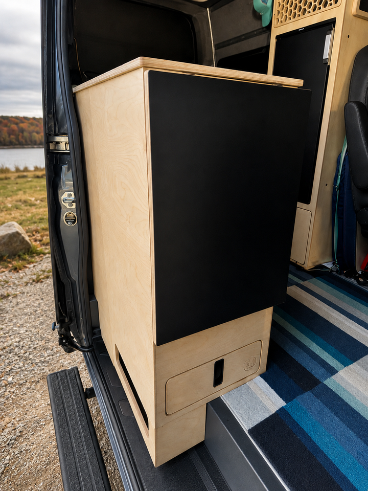Custom birch plywood kitchen cabinet with counter top inside a Mercedes Sprinter 144 camper van by Overland Interiors