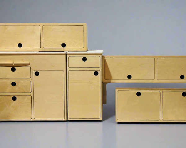 Modular Ford Transit camper van conversion kit components including cabinetry, storage, and interior furniture by Overland Interiors.