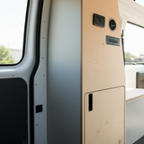 Overland Interiors camper van utility cabinet with built-in electrical controls and power storage for off-grid van conversions