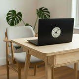 Overland Interiors van life and overland vinyl sticker displayed on a laptop.
