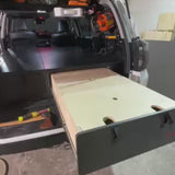 Video demonstrating the pull-out drawer system in the Overland Interiors 4Runner sleeping platform for SUV camping and overland travel