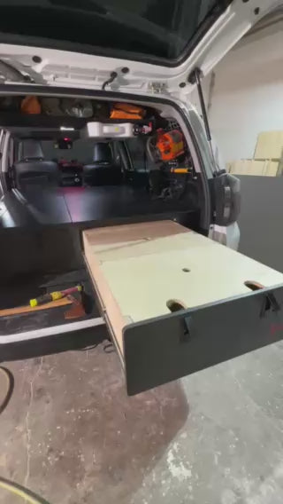 Video demonstrating the pull-out drawer system in the Overland Interiors 4Runner sleeping platform for SUV camping and overland travel