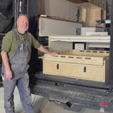 Van Builder, Andy from Overland Interiors demonstraing a sliding drawer system for camper vans and trucks.