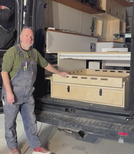 Van Builder, Andy from Overland Interiors demonstraing a sliding drawer system for camper vans and trucks.