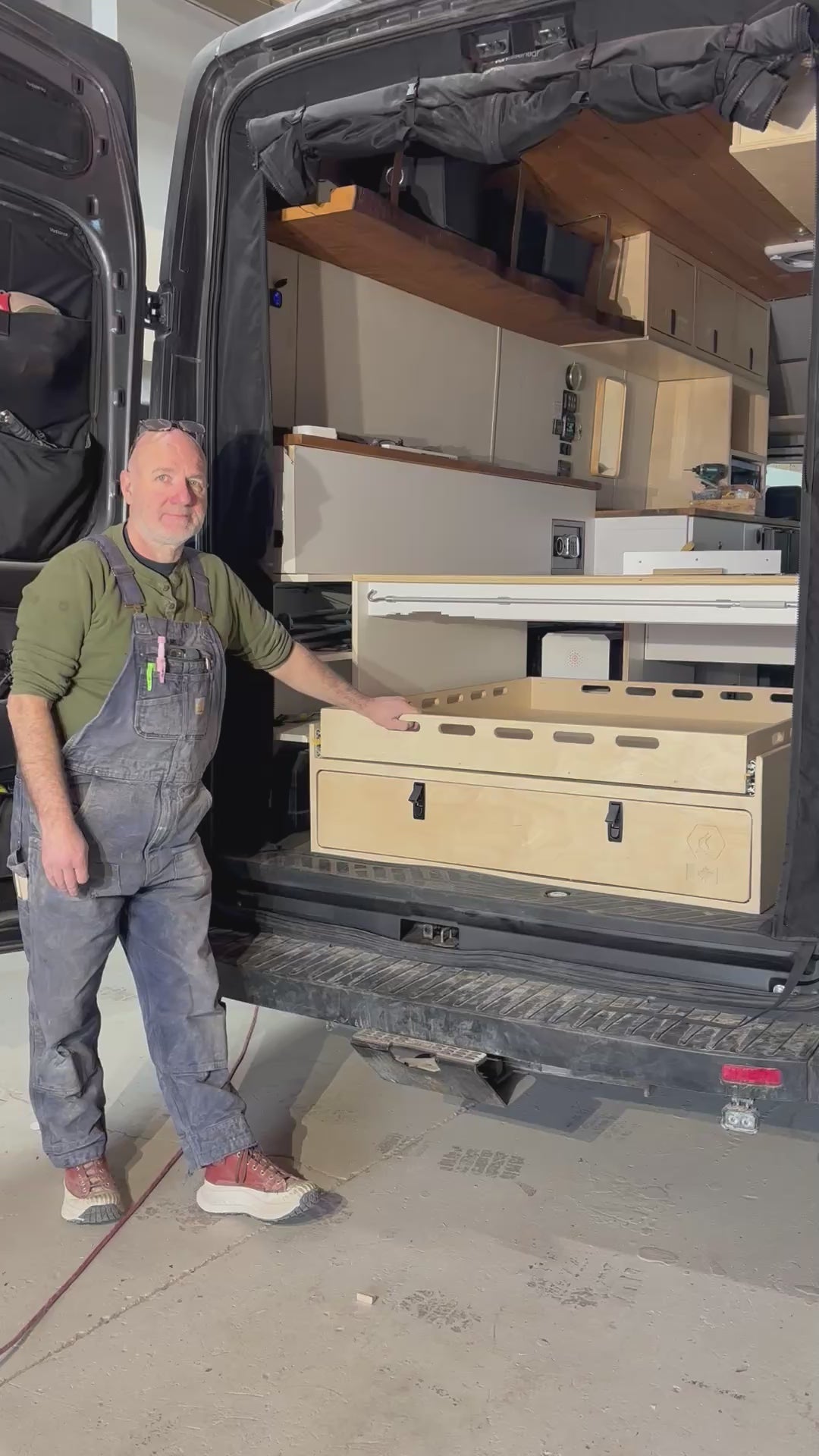 Van Builder, Andy from Overland Interiors demonstraing a sliding drawer system for camper vans and trucks.