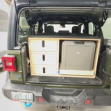 Short demonstration of a custom rear drawer and slide-out Dometic fridge storage system for a 2024 Jeep Wrangler 4xe, designed for organized camping and overland adventures by Overland Interiors