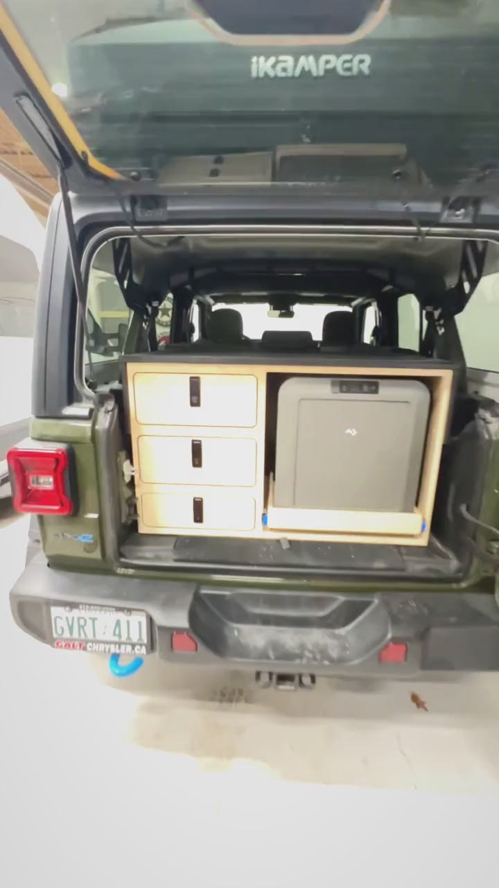 Short demonstration of a custom rear drawer and slide-out Dometic fridge storage system for a 2024 Jeep Wrangler 4xe, designed for organized camping and overland adventures by Overland Interiors