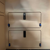 wooden panel with access doors and black rectangular latches surface