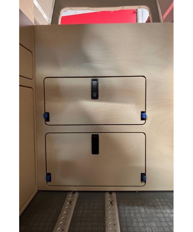 wooden panel with access doors and black rectangular latches surface