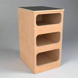 overland interiors' birch plywood base cabinet with three compartments and black laminate top  
